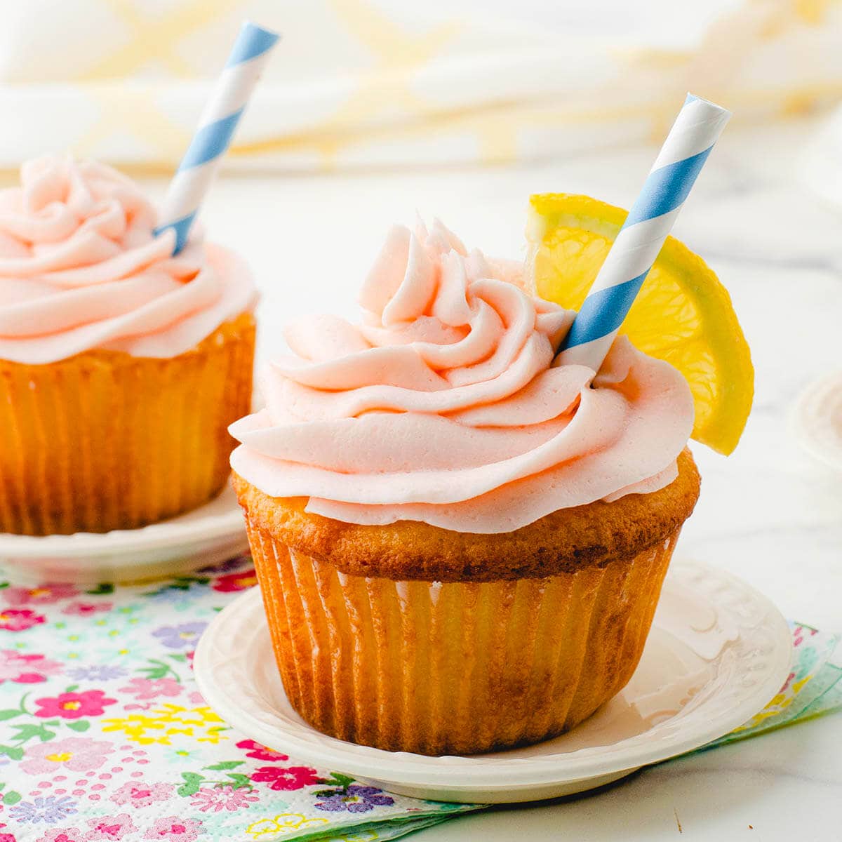 Pink Lemonade cupcakes on pretty plates.