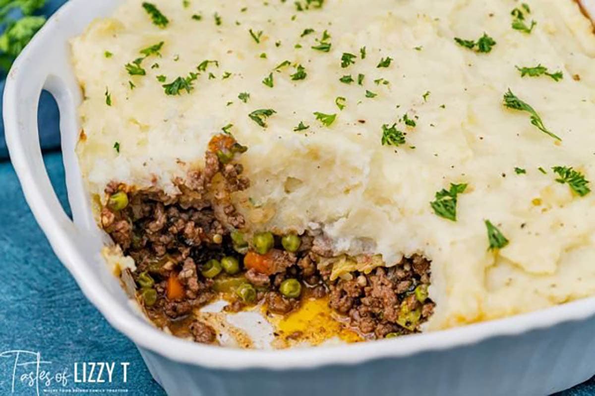 Shepherds pie in baking dish with scoop removed.