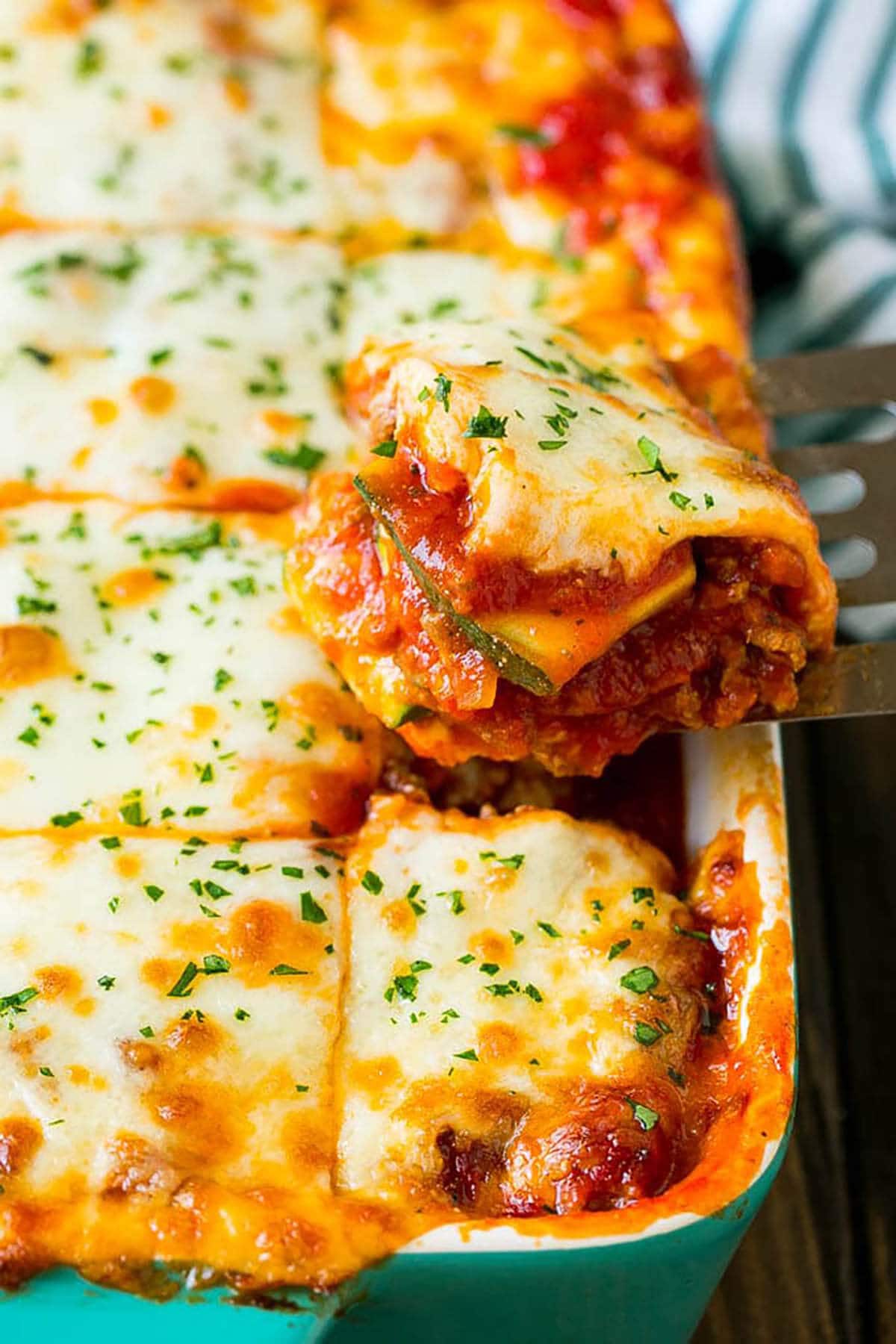 Cheesy zucchini lasagna in casserole dish.