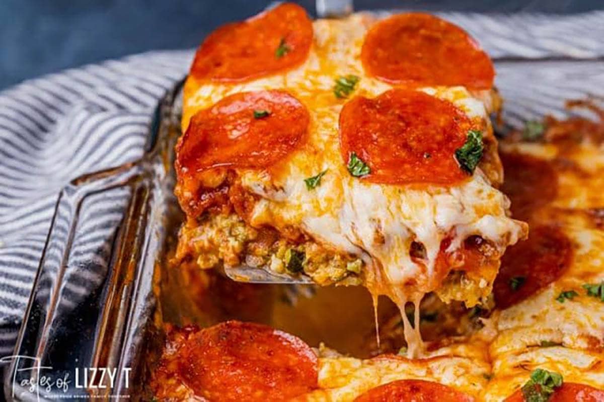 Cheesy zucchini pizza casserole in baking dish.