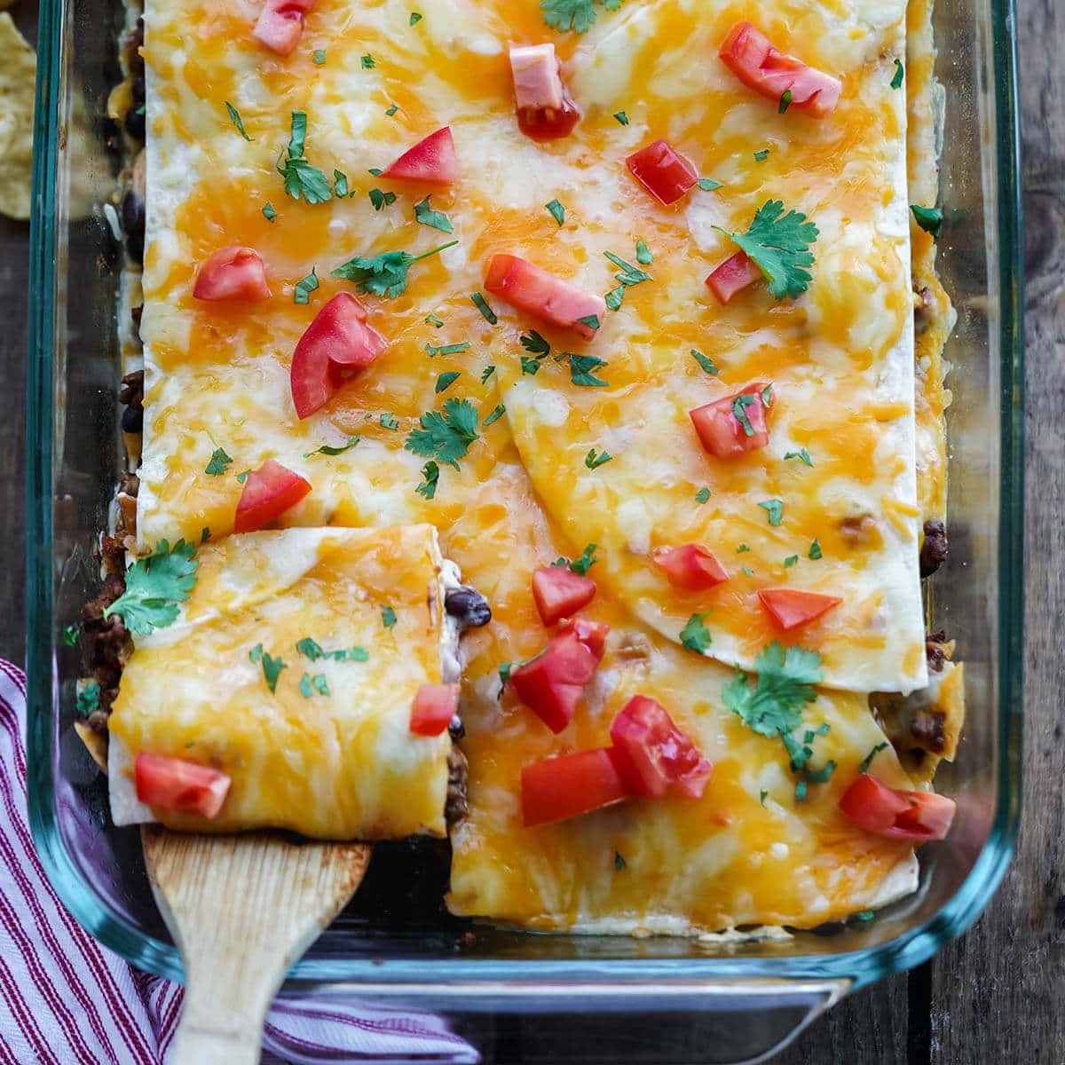 Casserole in baking dish with serving spatula.