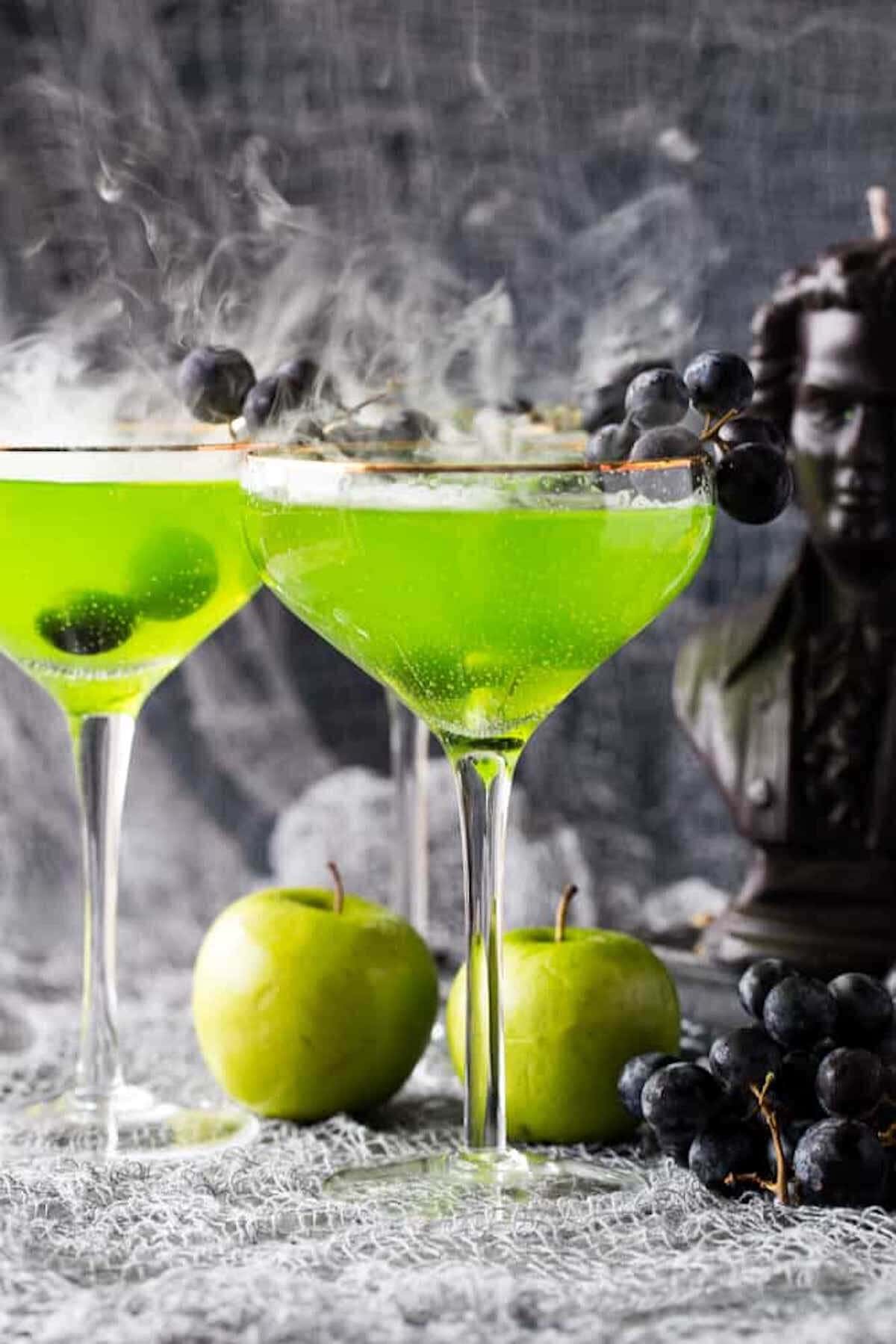 Lime green apple martinis on serving tray.