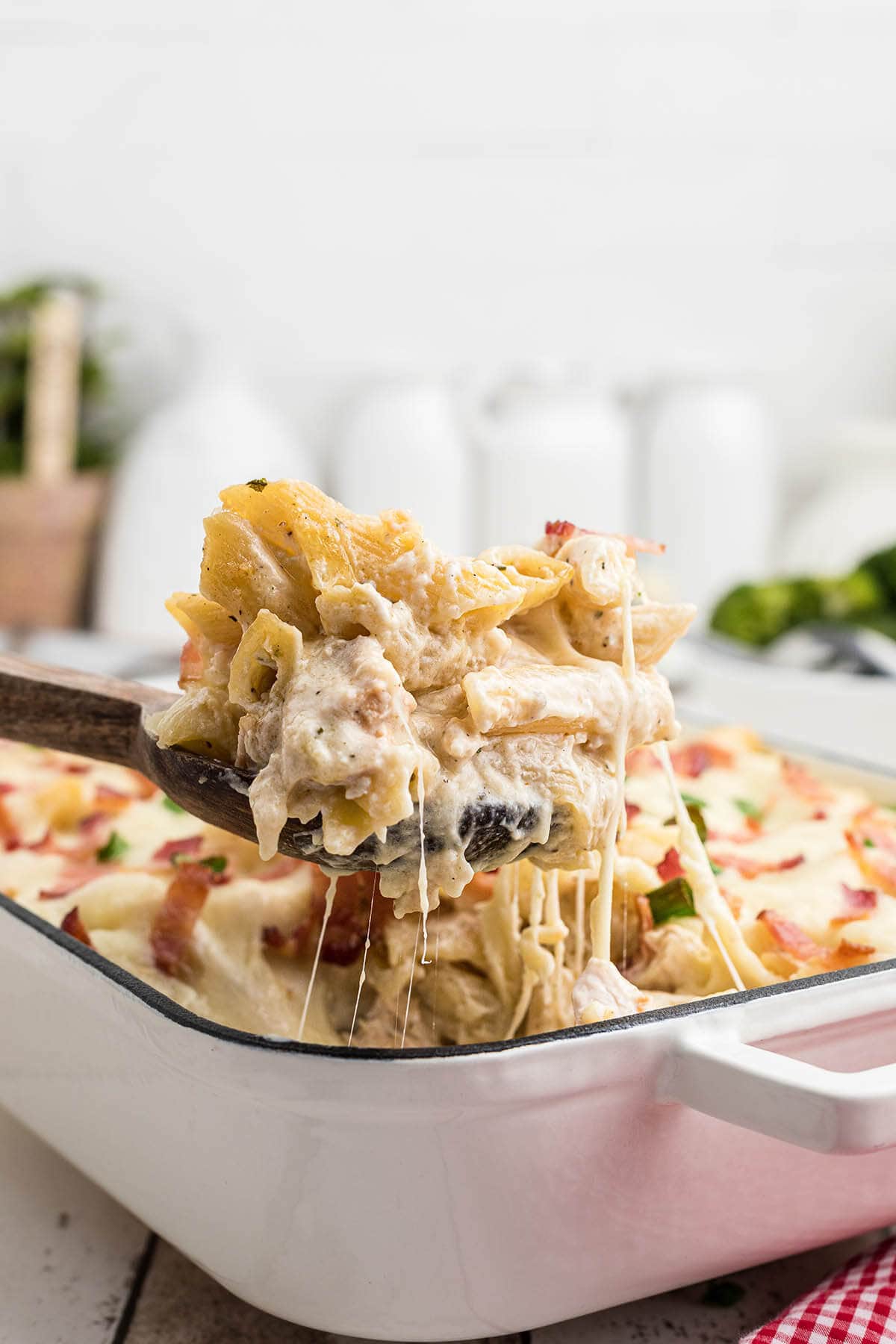 Cheesy pasta casserole in baking dish.