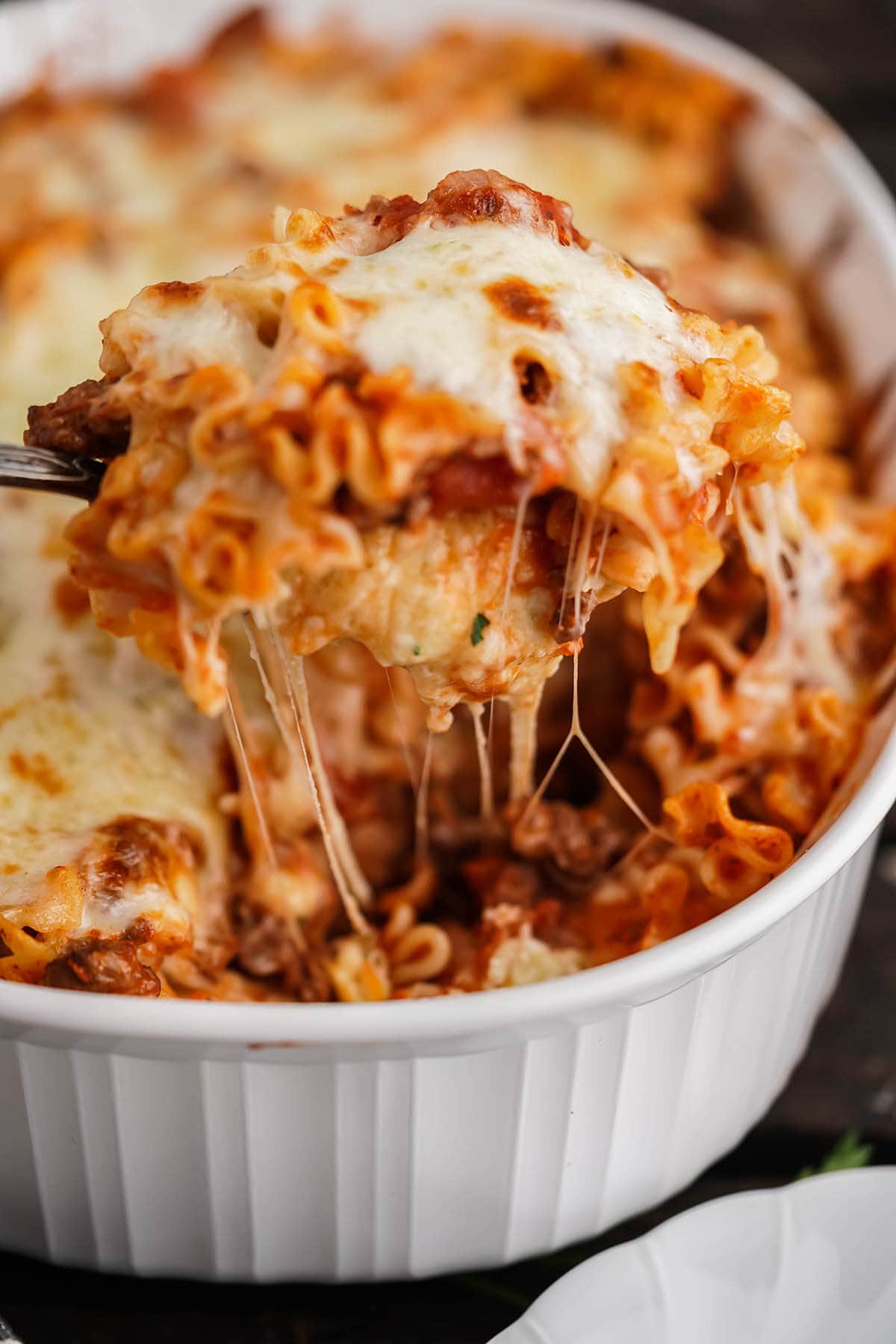 Lazy Lasagna Casserole in baking dish with serving spoon.