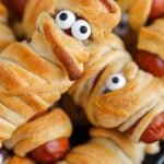 Mummy Hot Dogs on a platter. With print overlay for Pinterest.