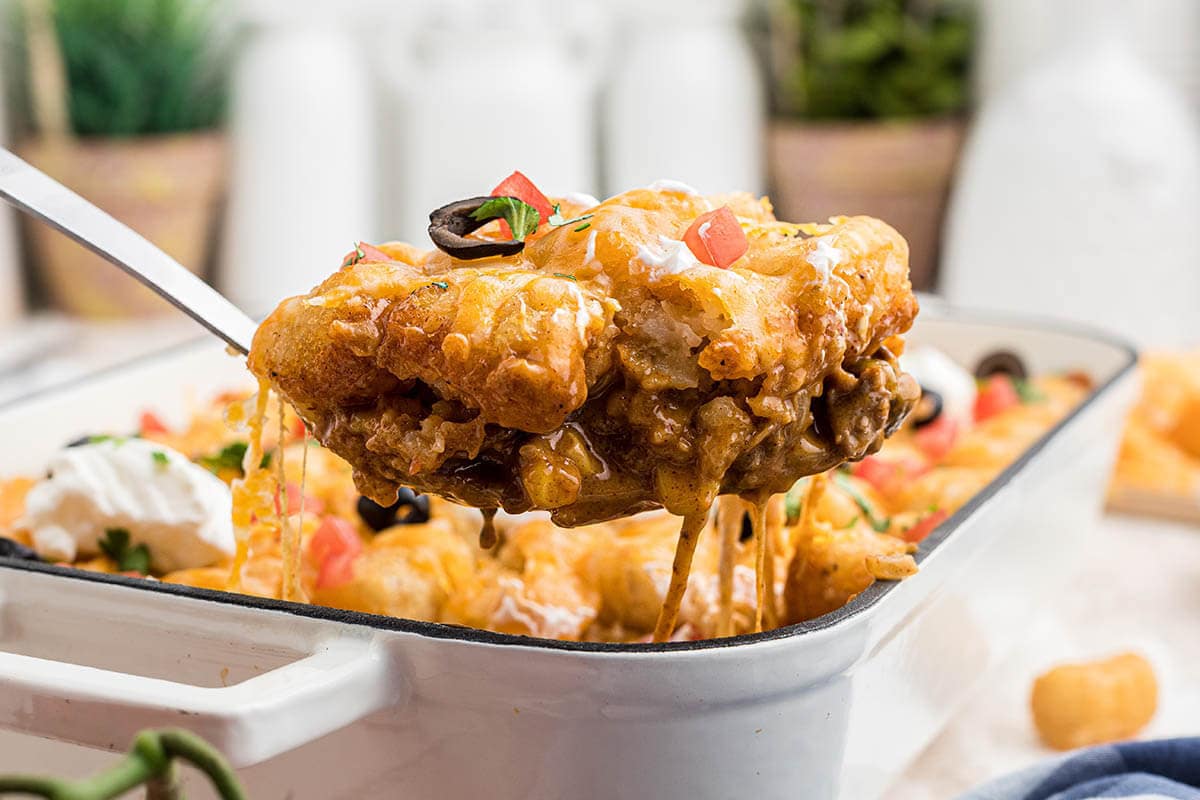 Casserole in baking dish with serving spoon.