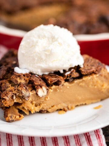 Impossible Pecan Pie on plate topped with ice cream.