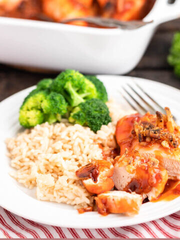 Apricot Chicken Casserole on plate with rice and broccoli.