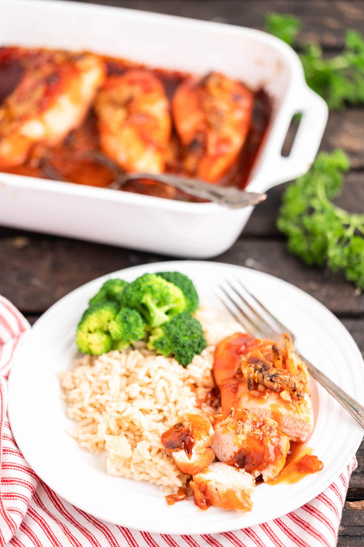 Sliced Apricot Chicken Casserole on plate with white rice.