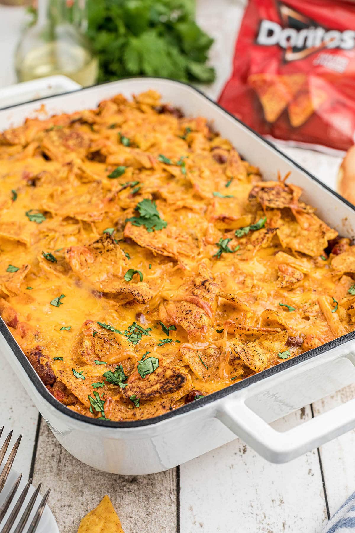 Cheesy casserole in baking dish topped with cilantro.