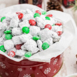 Holiday Muddy Buddies in tin with red and green m&m's.