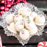 Christmas Peanut Butter Snowballs in pretty crystal dish.