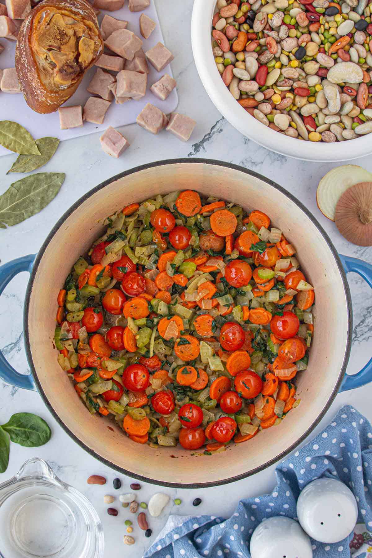 Sauteed vegetables in a stockpot.