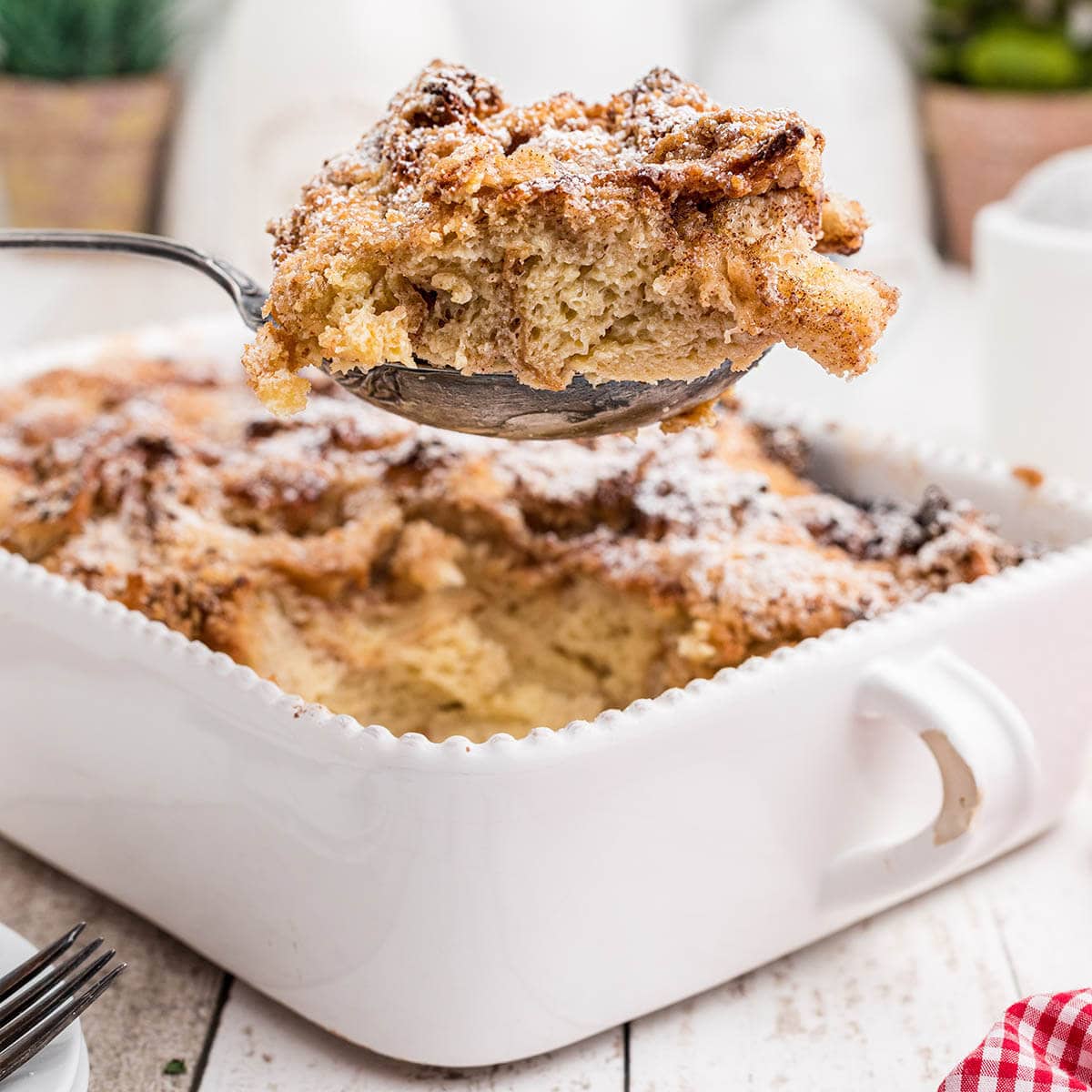 Casserole in baking dish with serving spoon.