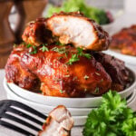 Baked bbq chicken thighs on platter.