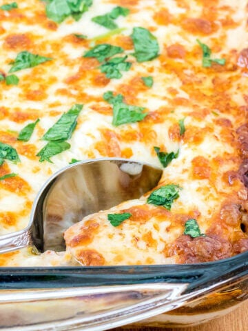 Casserole in baking dish with serving spoon.