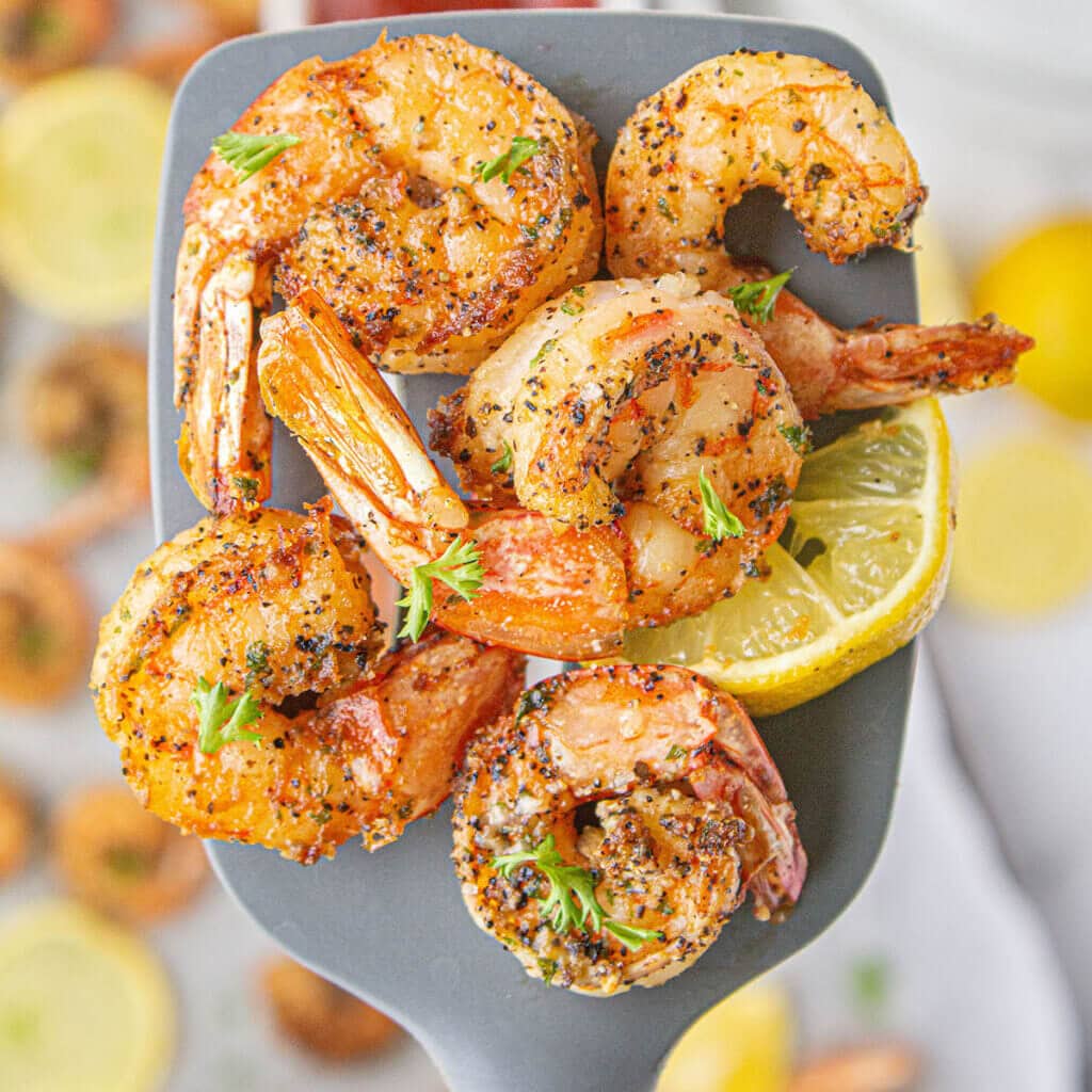 Cooked shrimp on spatula.