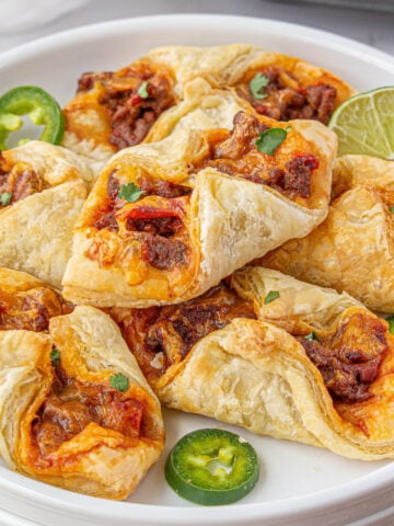Puff pastry tacos on platter.