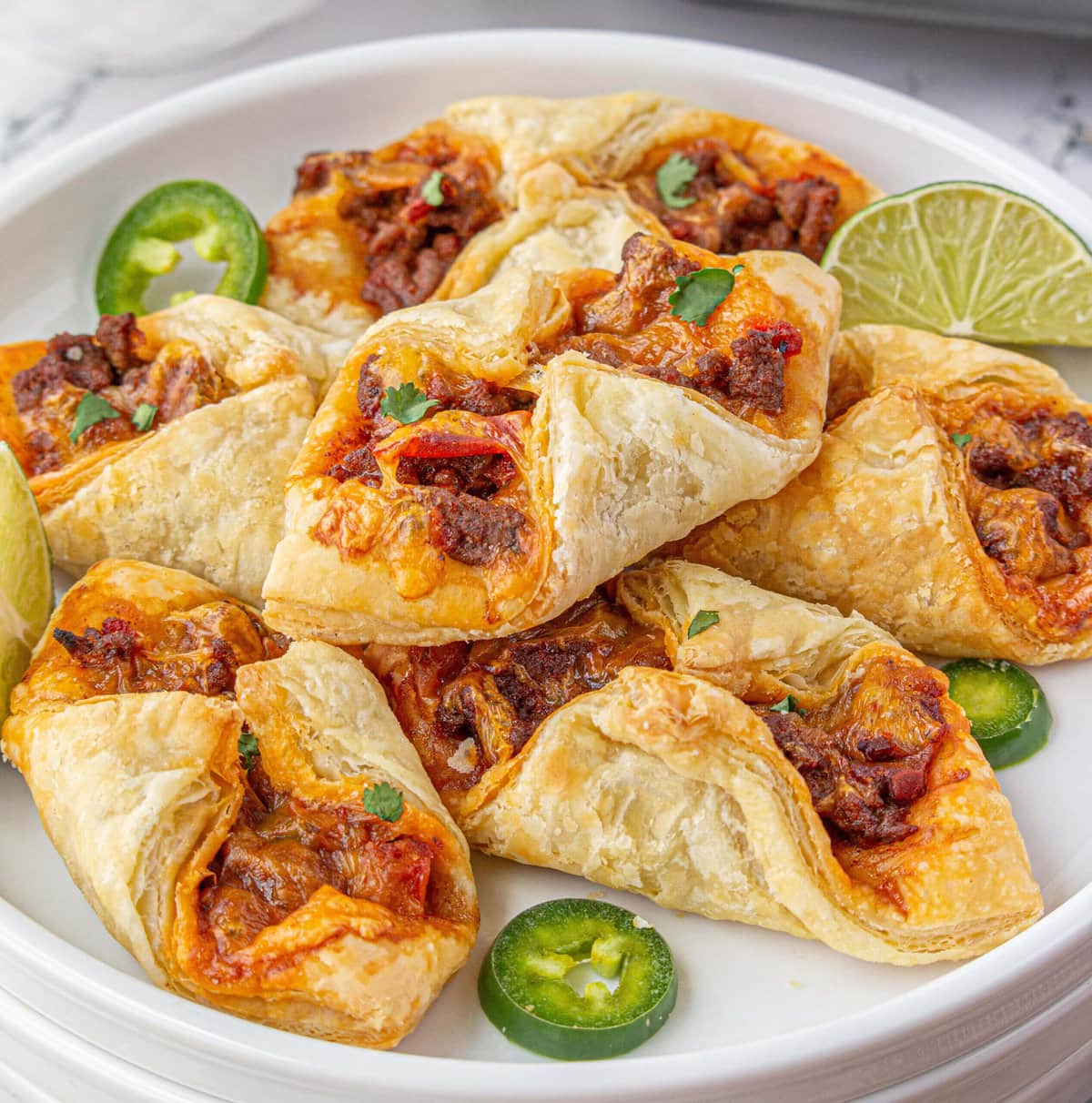 Puff pastry tacos on platter.