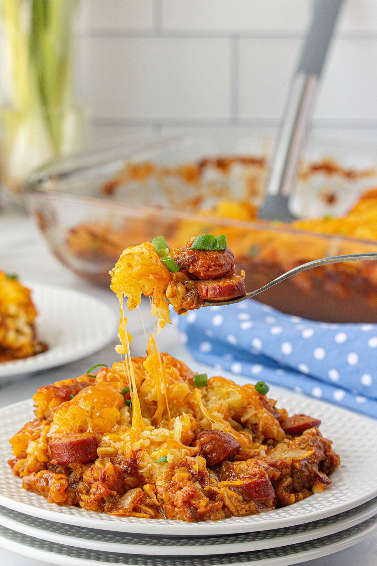 Chili Dog Tater Tot Casserole on plate with fork.