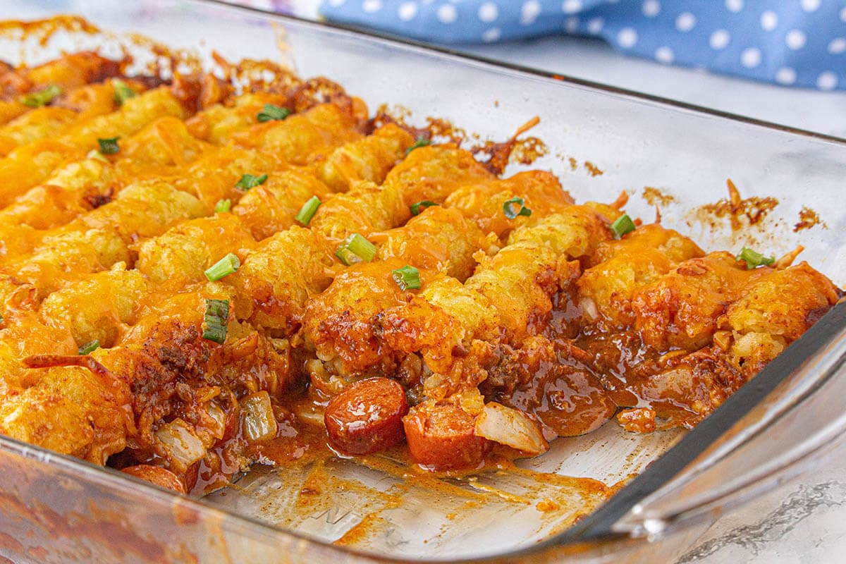 Casserole dish filled with tater tot hot dog casserole.