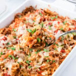 Casserole in a baking dish with a serving spoon.