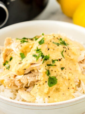 Shredded chicken over rice in a bowl.