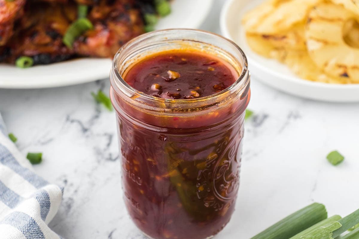 Small mason jar filled with Huli Huli Sauce.