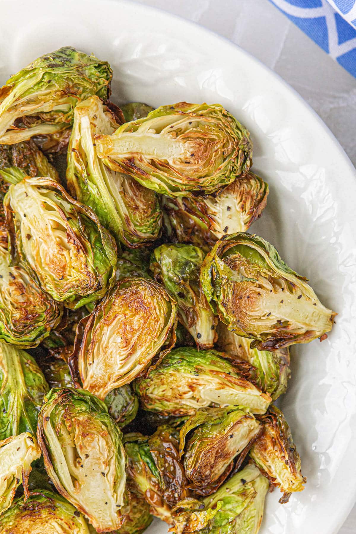 Caramelized fried brussels sprouts in bowl.