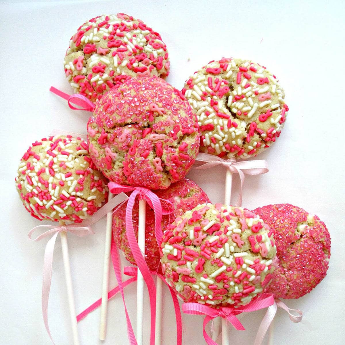 Pretty Pink Balloon cookies on a white platter.