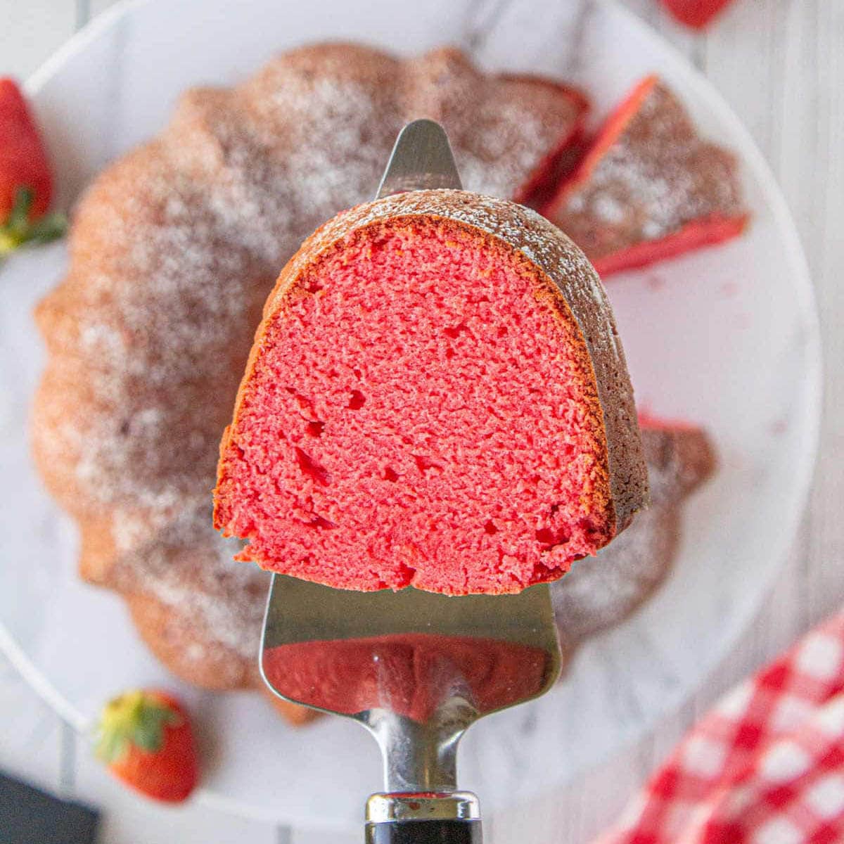 A slice of pink strawberry pound cake spatula.
