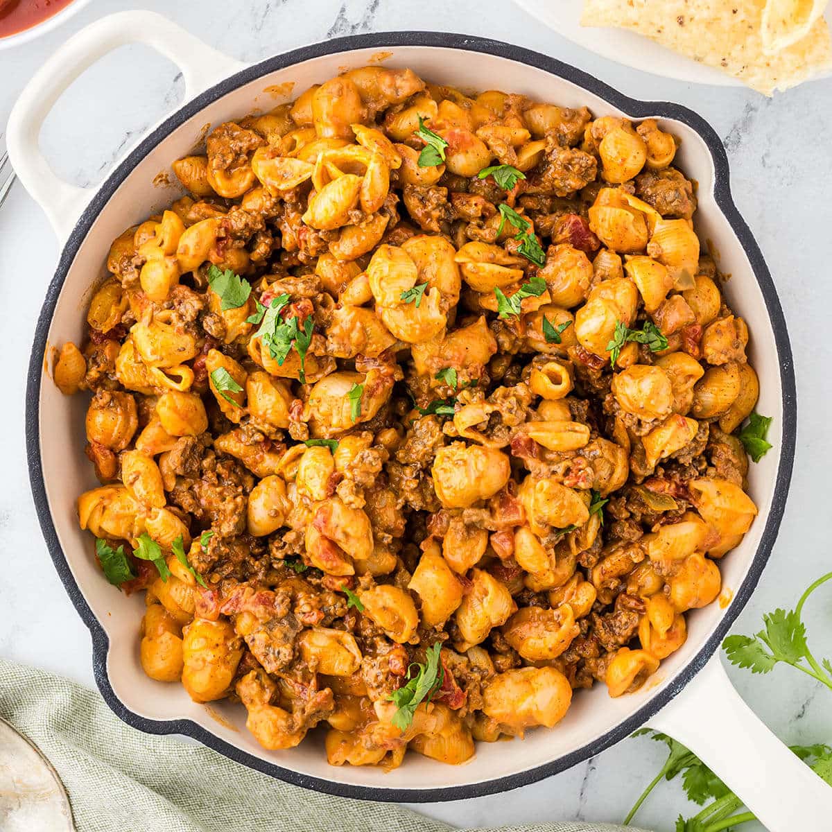 Taco Mac recipe in skillet topped with minced cilantro.