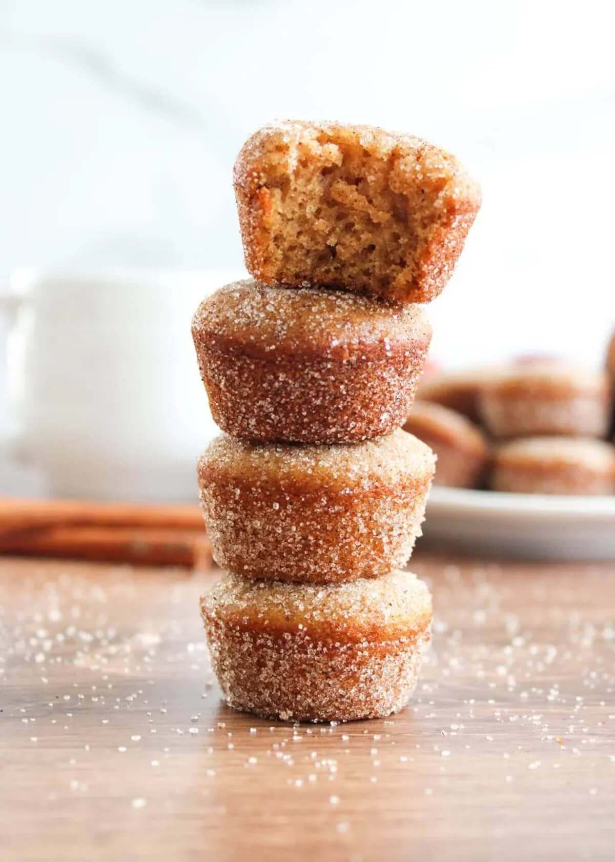 Apple Cider Muffins stacked on top of each other.