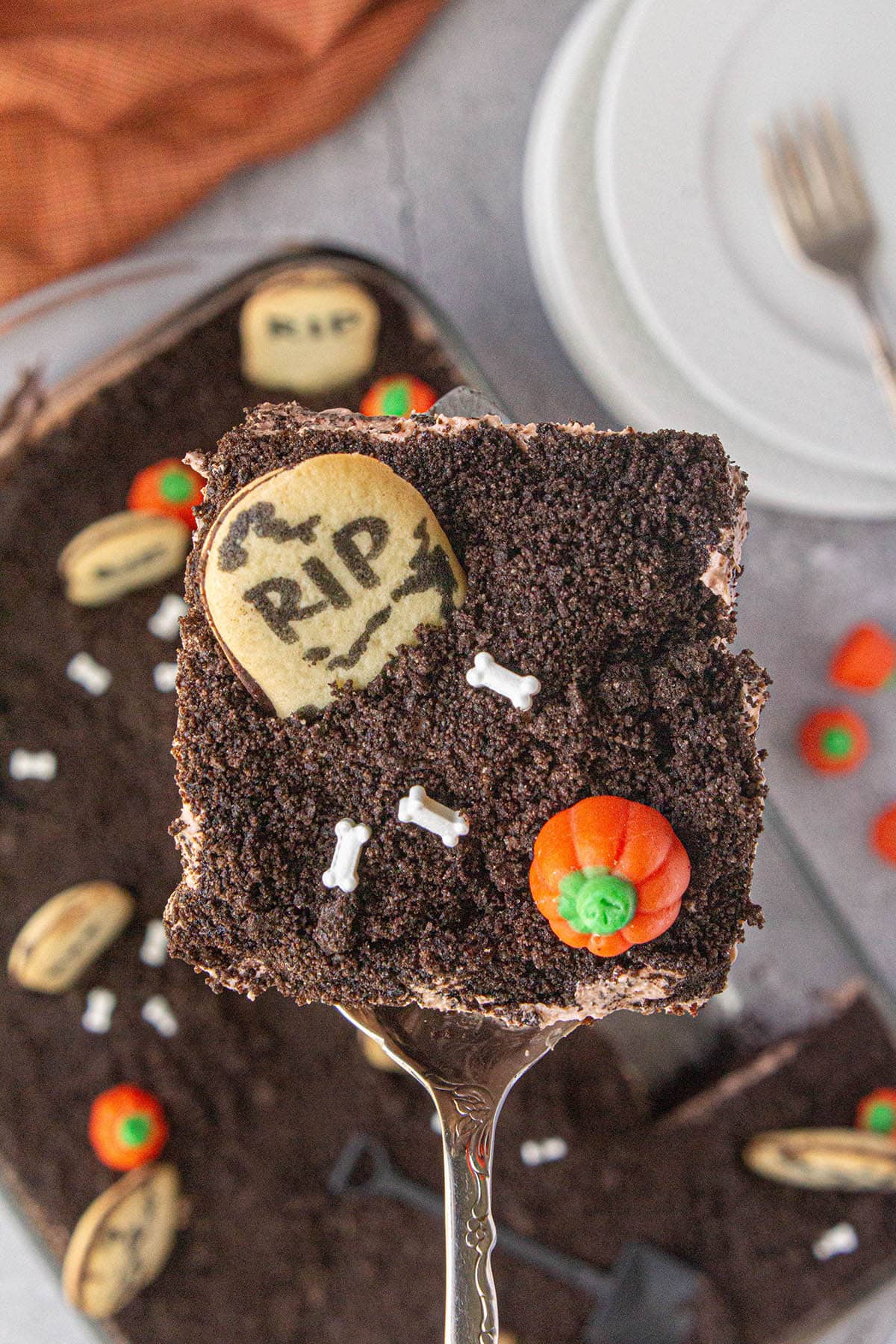 Slice of Halloween Dirt Cake on a serving spatula.