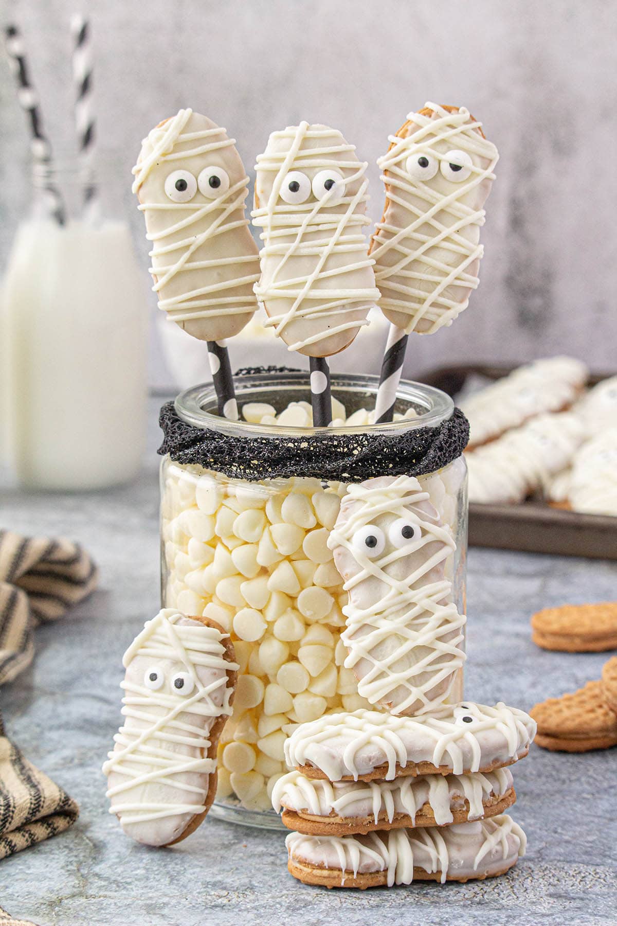 A stack of Nutter Butter Cookies decorated to look like mummies for Halloween.
