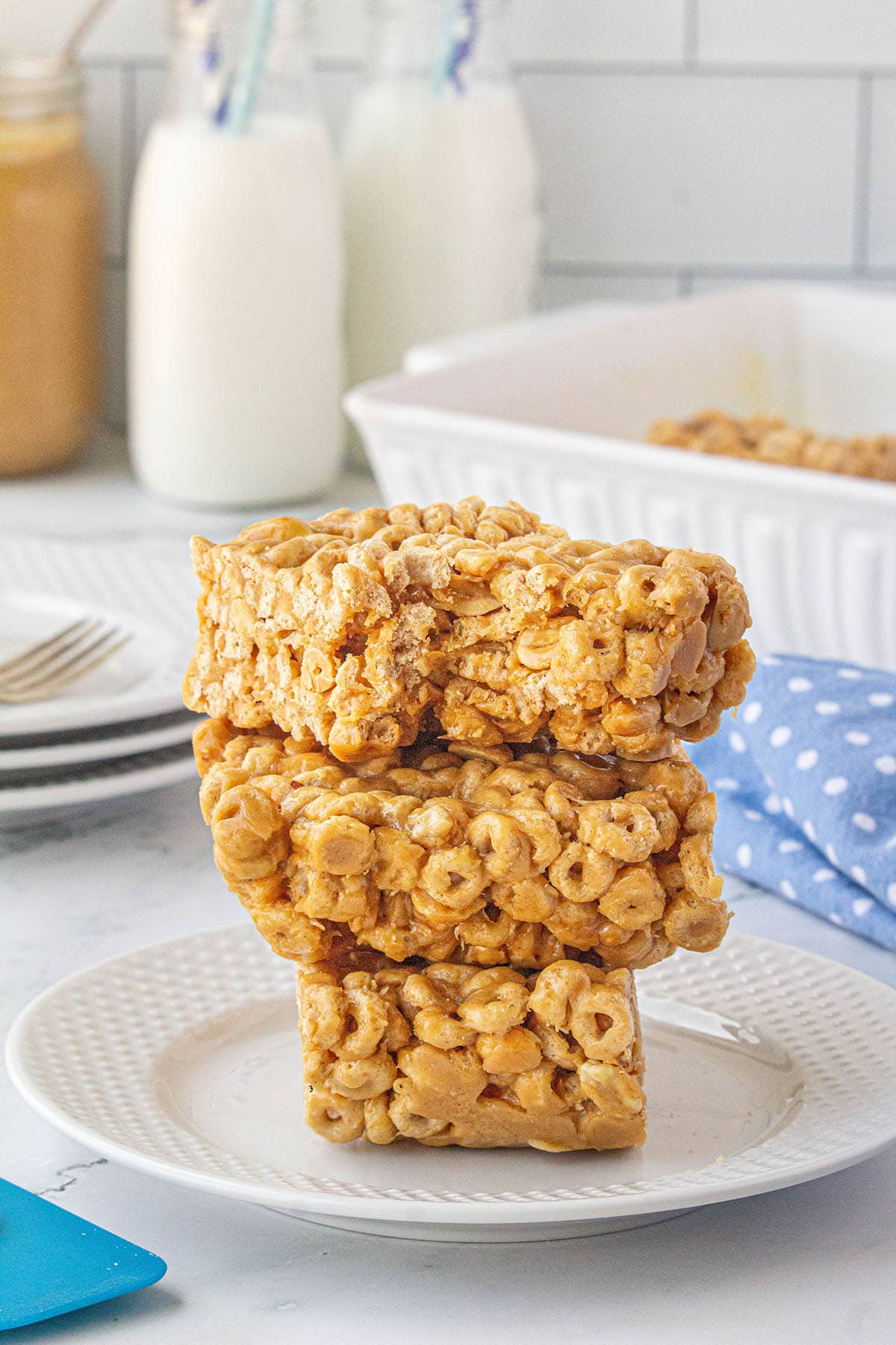 A stack of Cheerio Peanut Butter Bars on a plate.