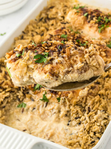 No Bake Chicken and Rice in a casserole dish with a serving spoon.