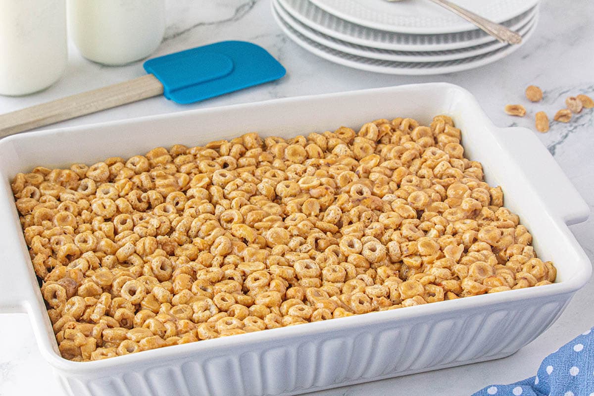 A baking dish filled with Peanut Butter Cheerios Bars.