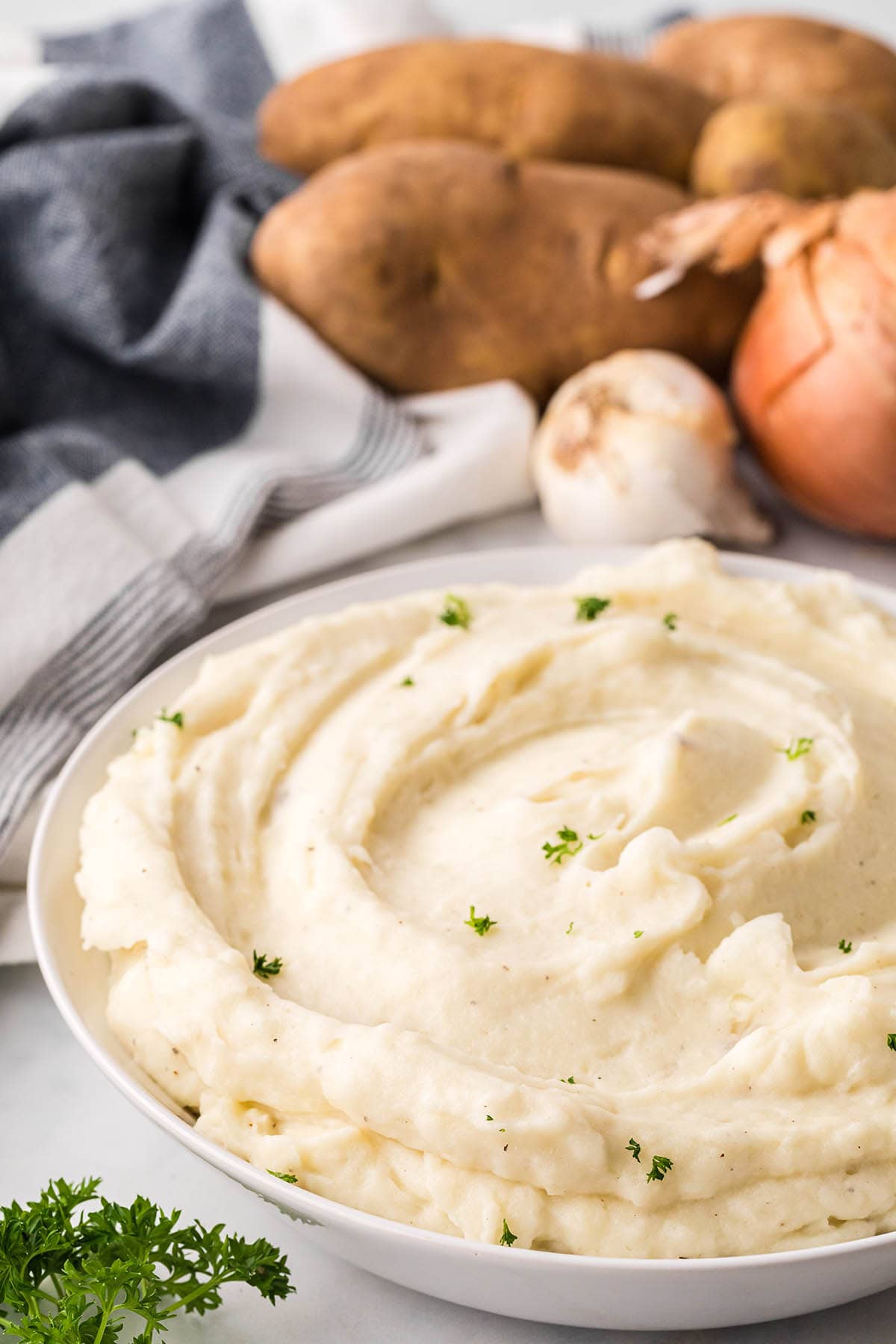 Large bowl filled with creamy mashed potatoes.