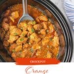 Orange Chicken made in a crockpot. There's a serving spoon ready to dish it up. With print overlay for Pinterest.