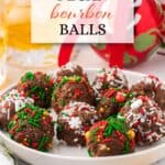 Pecan Bourbon Balls rolled in holiday sprinkles on a plate. With print overlay for Pinterest.