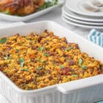Sausage and bacon stuffing in a casserole dish.