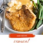 Crispy pork chop on a plate served with mashed potatoes and green beans. With print overlay for Pinterest.