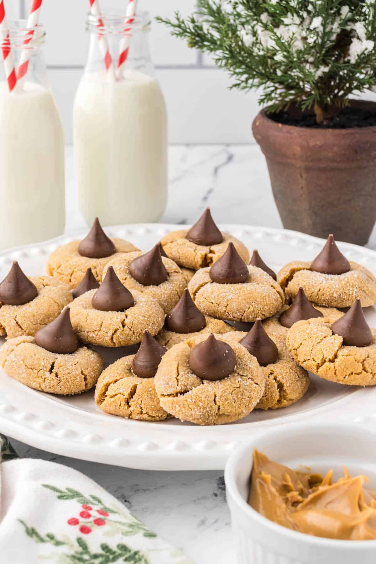 A large platter filled with peanut butter blossom cookies.