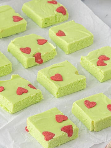 Slices of Grinch Fudge on wax paper.