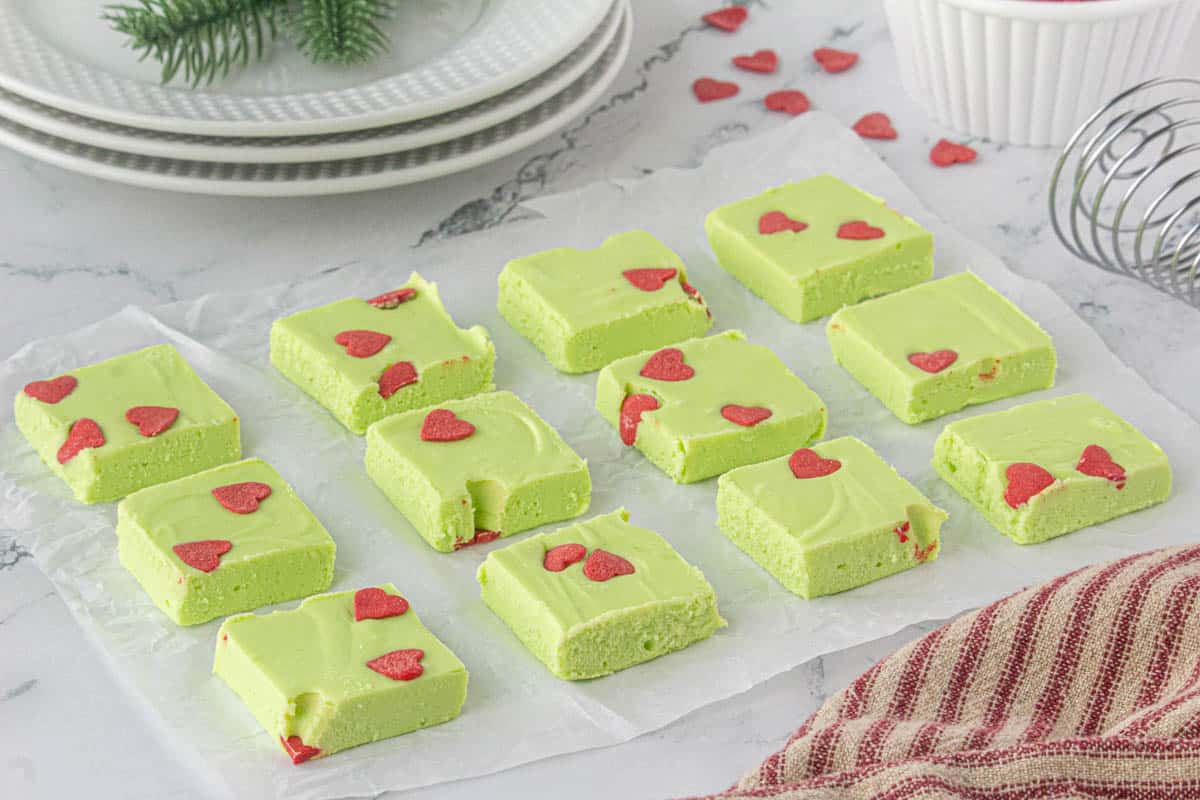 Slices of green fudge on wax paper.