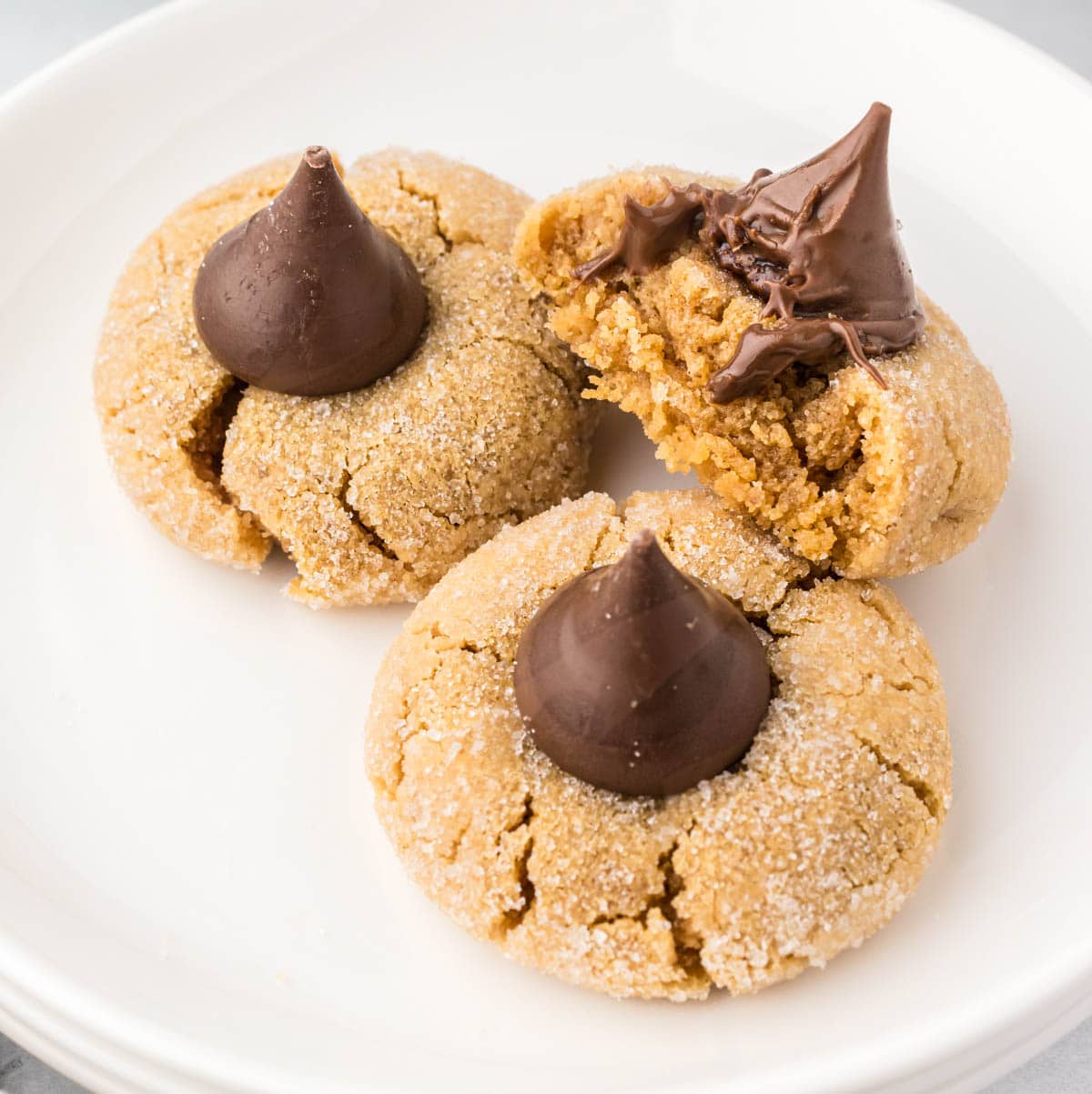 A plate filled with Peanut Butter Blossom cookies.