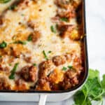 Cheesy pasta casserole in baking dish.