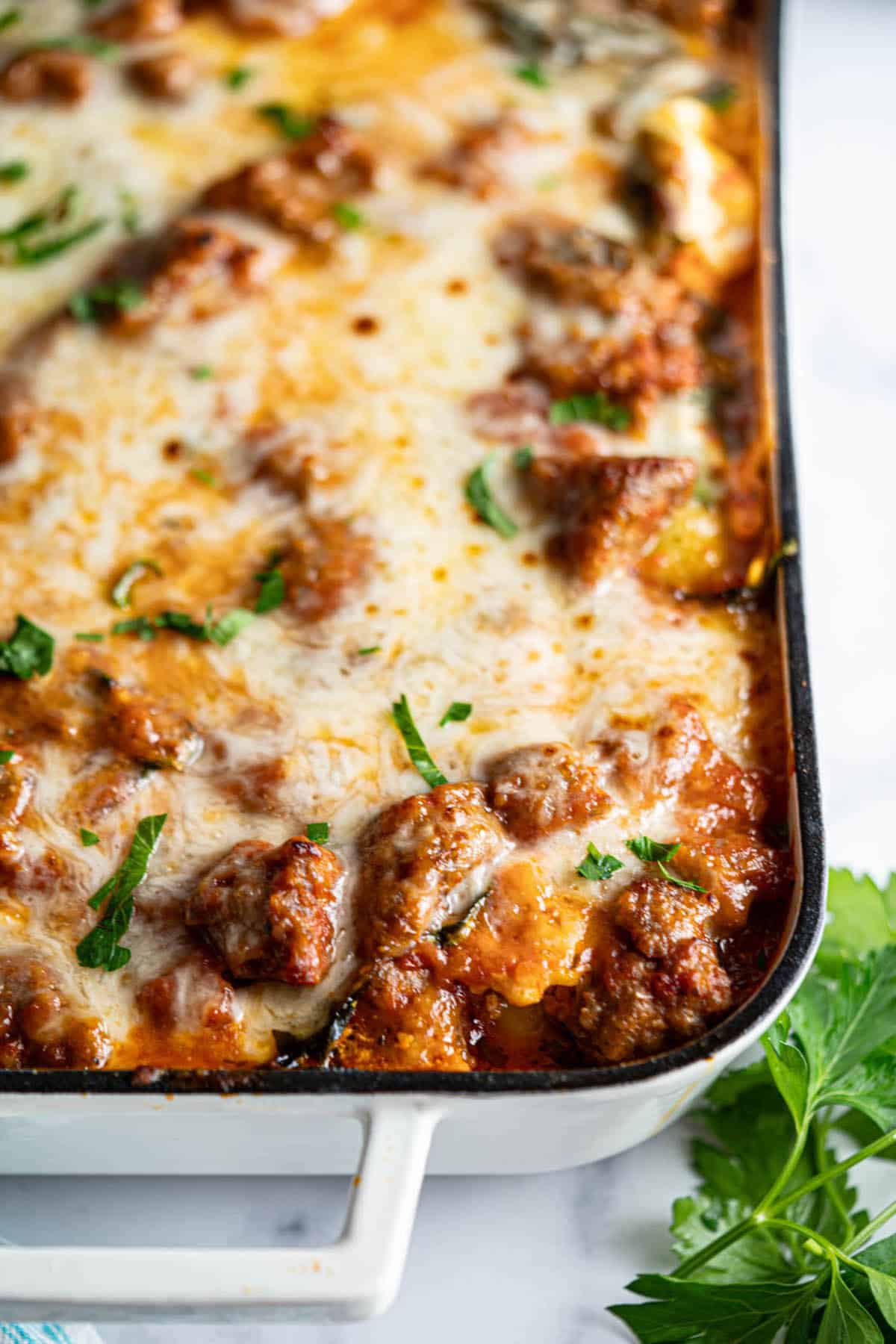 Cheesy pasta casserole in a baking dish.