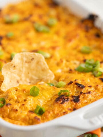 A casserole dish filled with a cheesy dip.